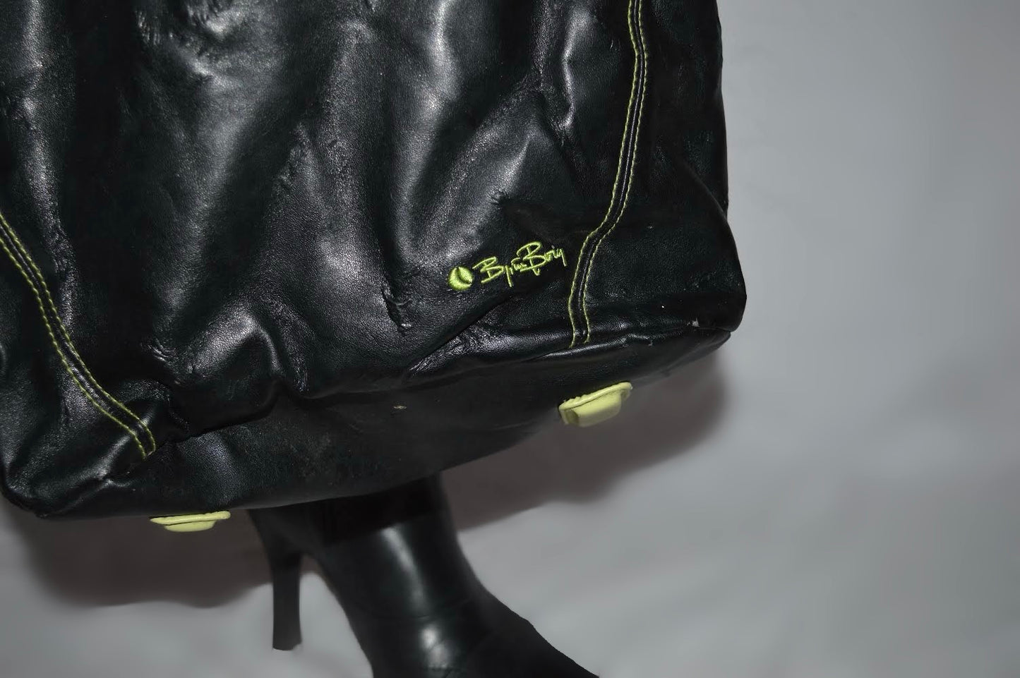 Black shoulder bag with green details