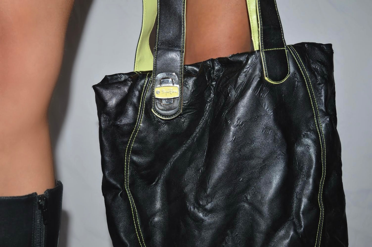 Black shoulder bag with green details